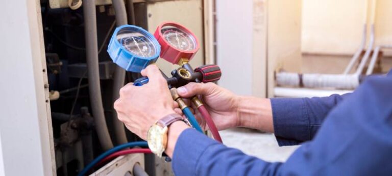 HVAC technician adding refrigerant